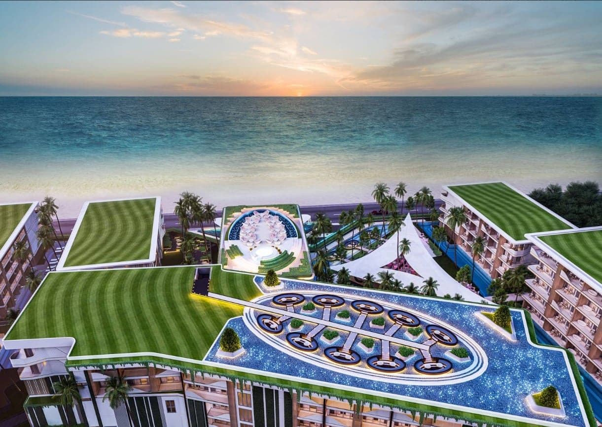 A building with a pool and a beach
