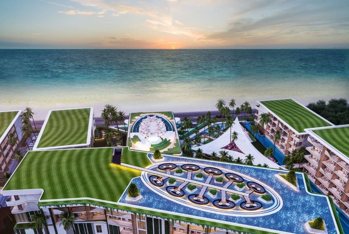 A building with a pool and a beach