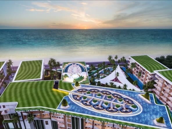 A building with a pool and a beach